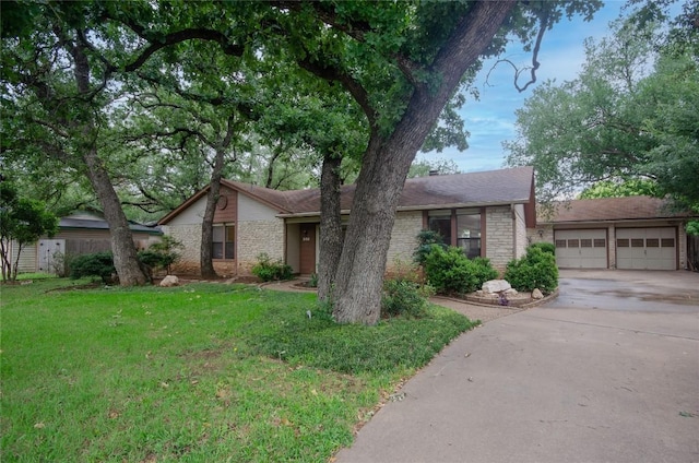 205 Mesa Verde St, Cedar Park, TX 78613 - mid-century home with brick siding, concrete driveway, a garage, and a front lawn