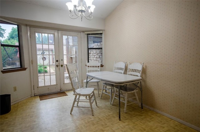 205 Mesa Verde St, Cedar Park, TX 78613 - dining space with wallpapered walls, a chandelier, french doors, and lofted ceiling