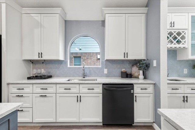 1522 Tamar Ln, Austin, TX 78727 - kitchen with dishwashing machine, decorative backsplash, white cabinetry, and light wood finished floors