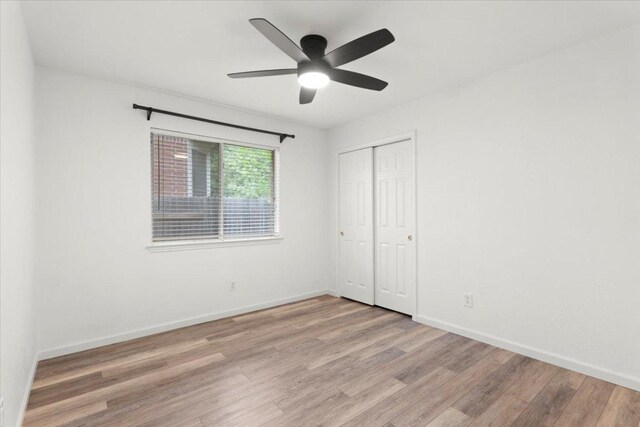 1522 Tamar Ln, Austin, TX 78727 - unfurnished bedroom featuring light wood-style flooring, a closet, and ceiling fan
