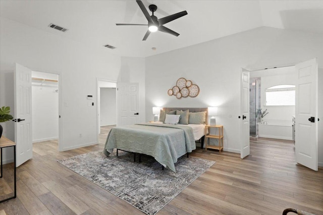 1522 Tamar Ln, Austin, TX 78727 - bedroom featuring light wood-type flooring, a walk in closet, ceiling fan, and high vaulted ceiling