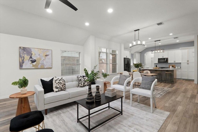 1522 Tamar Ln, Austin, TX 78727 - living room with a ceiling fan, light wood finished floors, recessed lighting, and a chandelier