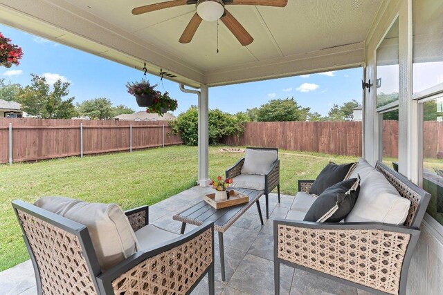 1401 Jackie Robinson Pl, Round Rock, TX 78665 - fenced backyard with an outdoor hangout area, ceiling fan, and a patio