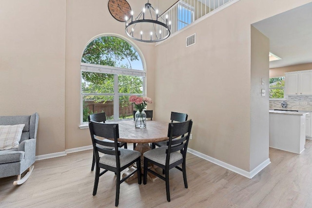 1401 Jackie Robinson Pl, Round Rock, TX 78665 - dining space featuring light wood-type flooring and a chandelier