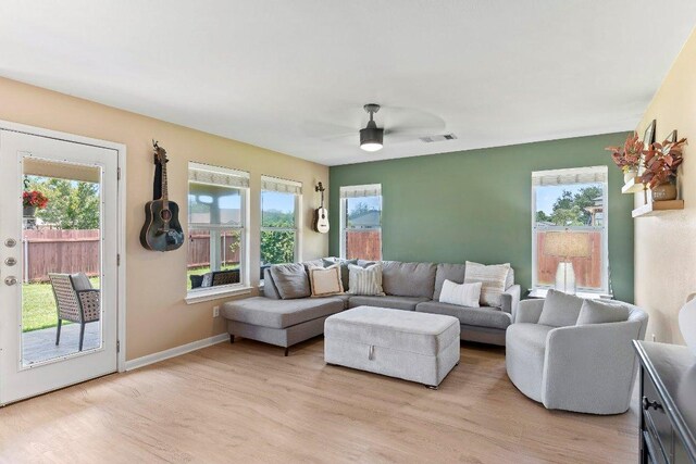 1401 Jackie Robinson Pl, Round Rock, TX 78665 - living room with light wood-style flooring and plenty of natural light