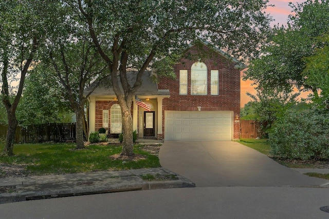 1401 Jackie Robinson Pl, Round Rock, TX 78665 - traditional home featuring concrete driveway, brick siding, and a garage