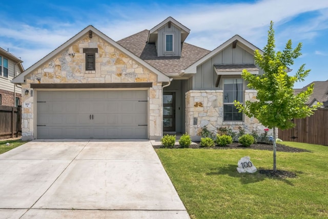 100 Rebel Red Cv, Liberty Hill, TX 78642 - view of front facade with stone siding, concrete driveway, an attached garage, roof with shingles, and board and batten siding