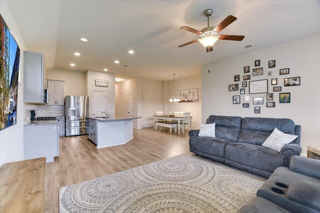 100 Rebel Red Cv, Liberty Hill, TX 78642 - living area with a ceiling fan, light wood-type flooring, recessed lighting, and a chandelier