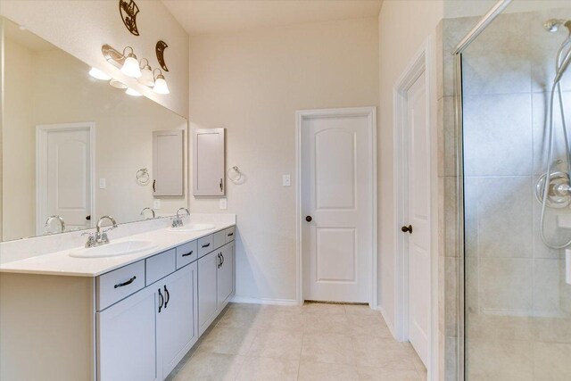 100 Rebel Red Cv, Liberty Hill, TX 78642 - bathroom with double vanity, a stall shower, and tile patterned flooring