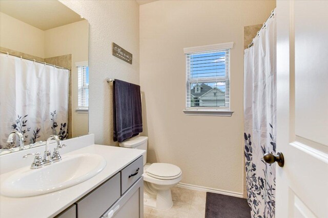 100 Rebel Red Cv, Liberty Hill, TX 78642 - full bathroom featuring vanity, healthy amount of natural light, tile patterned floors, and a shower with shower curtain