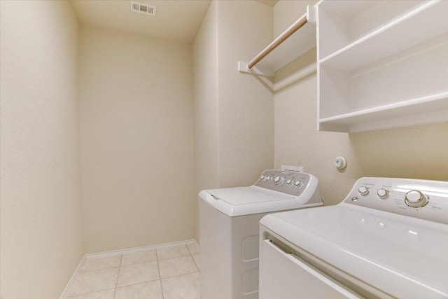 100 Rebel Red Cv, Liberty Hill, TX 78642 - washroom with washing machine and dryer and light tile patterned floors