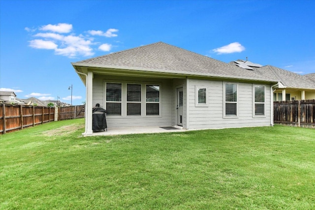 100 Rebel Red Cv, Liberty Hill, TX 78642 - rear view of house with a fenced backyard, a patio area, and a shingled roof