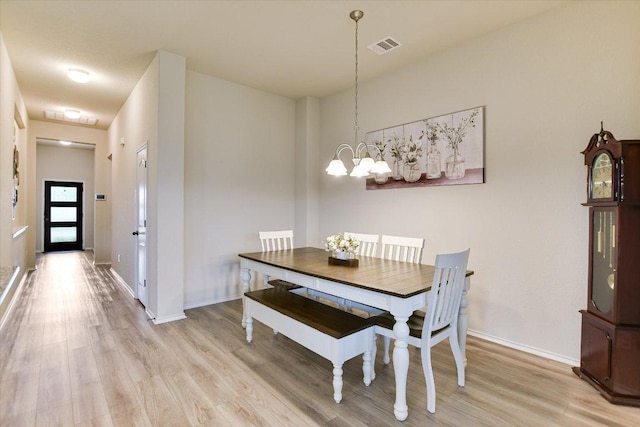 100 Rebel Red Cv, Liberty Hill, TX 78642 - dining room featuring light wood finished floors and a chandelier