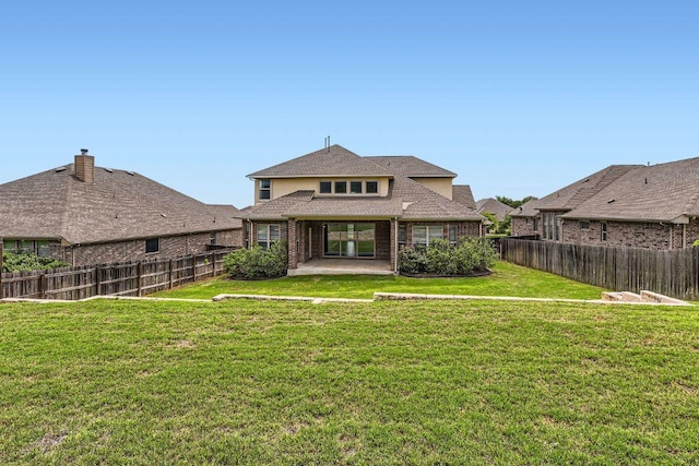 12383 Mesa Verde Dr, Austin, TX 78737 - rear view of house featuring a patio area, a fenced backyard, roof with shingles, and brick siding