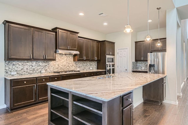 12383 Mesa Verde Dr, Austin, TX 78737 - kitchen featuring appliances with stainless steel finishes, open shelves, dark brown cabinets, under cabinet range hood, and recessed lighting