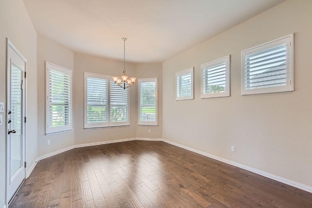 12383 Mesa Verde Dr, Austin, TX 78737 - unfurnished room featuring dark wood finished floors and a chandelier