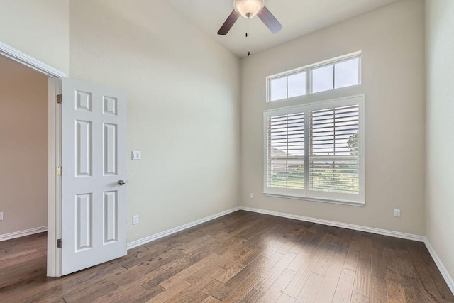 12383 Mesa Verde Dr, Austin, TX 78737 - spare room featuring plenty of natural light, ceiling fan, dark wood-style flooring, and a high ceiling