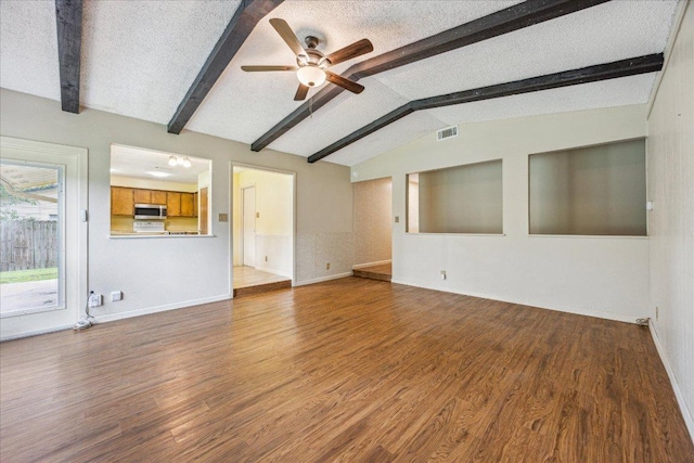 9613 Newberry Dr, Austin, TX 78729 - unfurnished living room with a ceiling fan and wood finished floors