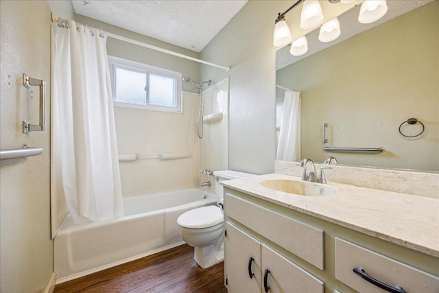 9613 Newberry Dr, Austin, TX 78729 - full bathroom with shower / bath combo, vanity, wood finished floors, and a textured ceiling