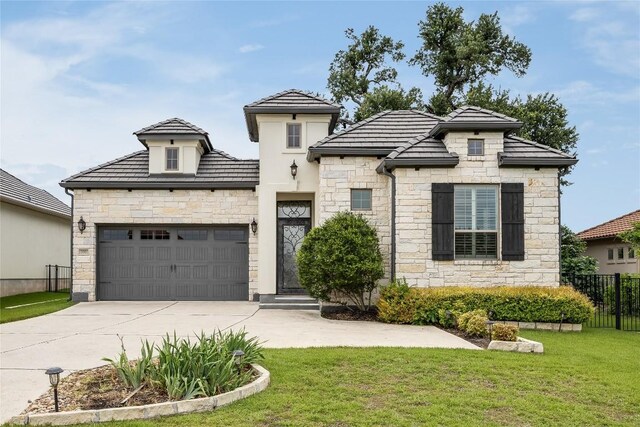 232 Cimarron Hills Trl E, Georgetown, TX 78628 - view of front of house with stone siding, concrete driveway, and a garage