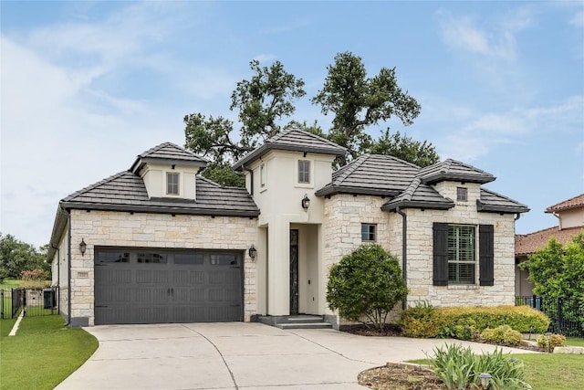 232 Cimarron Hills Trl E, Georgetown, TX 78628 - view of front of property with stone siding, driveway, and a garage