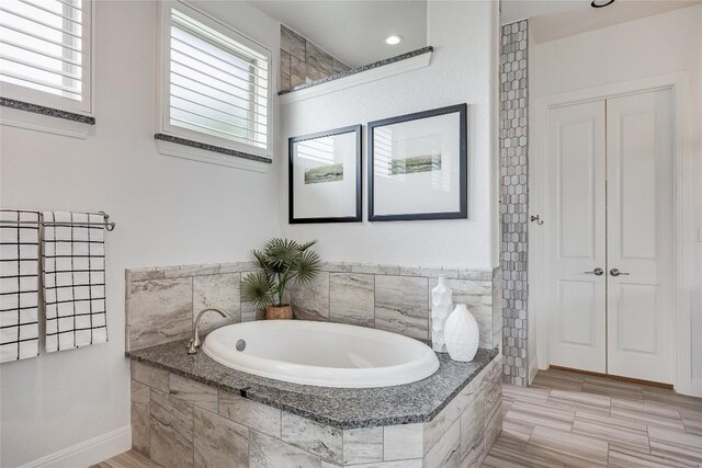 232 Cimarron Hills Trl E, Georgetown, TX 78628 - full bath with a garden tub, healthy amount of natural light, and a closet