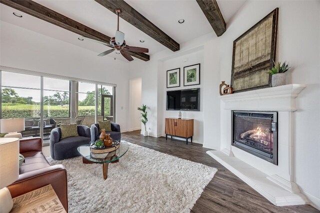 232 Cimarron Hills Trl E, Georgetown, TX 78628 - living room featuring ceiling fan, dark wood-style floors, beamed ceiling, a glass covered fireplace, and recessed lighting
