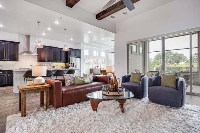 232 Cimarron Hills Trl E, Georgetown, TX 78628 - living area with light wood-type flooring, plenty of natural light, recessed lighting, beam ceiling, and ceiling fan