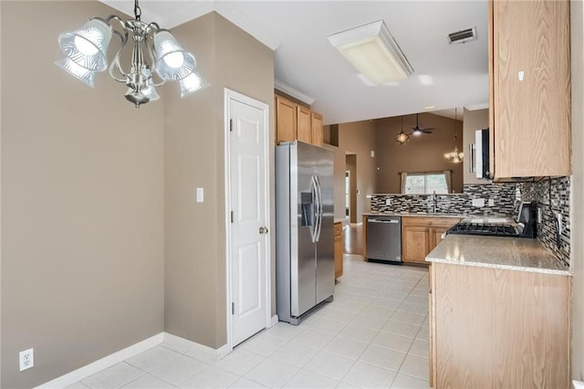 7500 Shadowridge Run Unit 47, Austin, TX 78749 - kitchen with appliances with stainless steel finishes, a chandelier, light tile patterned flooring, backsplash, and crown molding