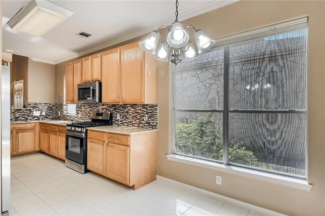 7500 Shadowridge Run Unit 47, Austin, TX 78749 - kitchen featuring appliances with stainless steel finishes, decorative backsplash, light countertops, a chandelier, and crown molding