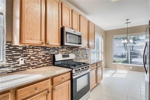 7500 Shadowridge Run Unit 47, Austin, TX 78749 - kitchen with stainless steel appliances, crown molding, light tile patterned floors, decorative backsplash, and hanging light fixtures