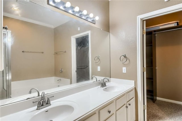 7500 Shadowridge Run Unit 47, Austin, TX 78749 - bathroom with double vanity, a bath, and crown molding