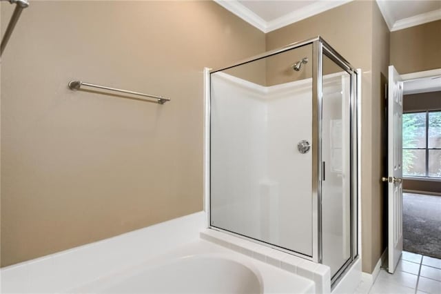 7500 Shadowridge Run Unit 47, Austin, TX 78749 - bathroom featuring a stall shower, crown molding, a bath, and tile patterned floors