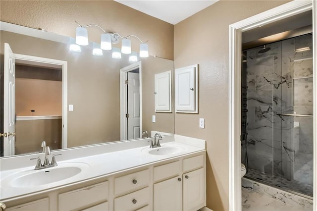 7500 Shadowridge Run Unit 47, Austin, TX 78749 - bathroom with a marble finish shower, marble finish flooring, and double vanity