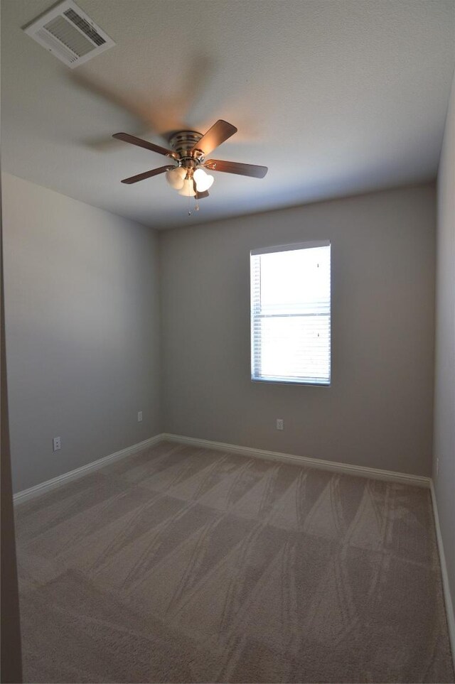 6814 E Riverside Dr Unit 52, Austin, TX 78741 - empty room featuring carpet and ceiling fan