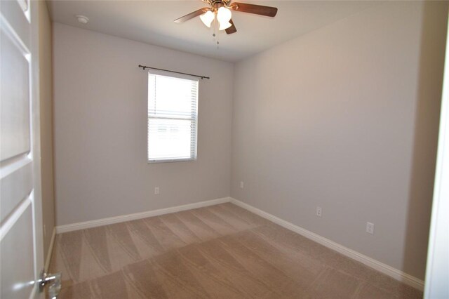 6814 E Riverside Dr Unit 52, Austin, TX 78741 - empty room with light carpet, ceiling fan, and a smoke detector
