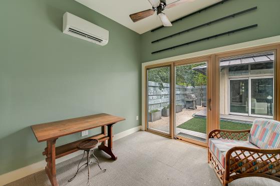 2822 Wooldridge Dr Unit B, Austin, TX 78703 - office space with an AC wall unit, a ceiling fan, and light colored carpet