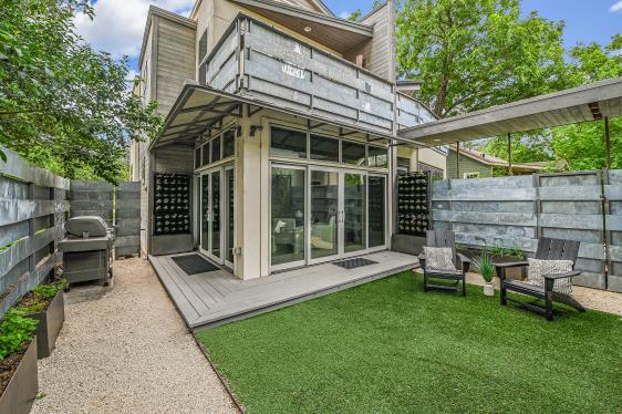 2822 Wooldridge Dr Unit B, Austin, TX 78703 - back of house with a fenced backyard and a wooden deck
