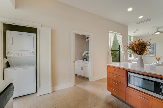 2822 Wooldridge Dr Unit B, Austin, TX 78703 - washroom with estacked washer and dryer, a ceiling fan, and recessed lighting