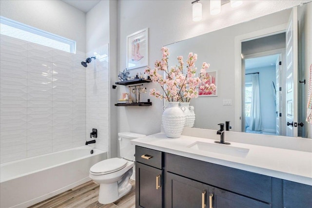 351 Kings Pine Dr, Dripping Springs, TX 78620 - bathroom featuring wood finished floors, vanity, and shower / bath combination