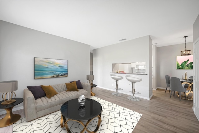 12166 Metric Blvd Unit 2011, Austin, TX 78758 - living room featuring light wood-type flooring and baseboards