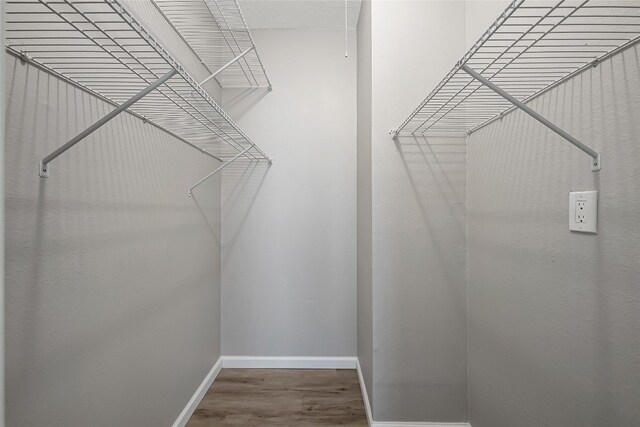 12166 Metric Blvd Unit 2011, Austin, TX 78758 - spacious closet with wood finished floors