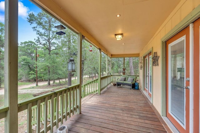 928 Moccasin Trl, La Grange, TX 78945 - wooden porch with view of wooded area