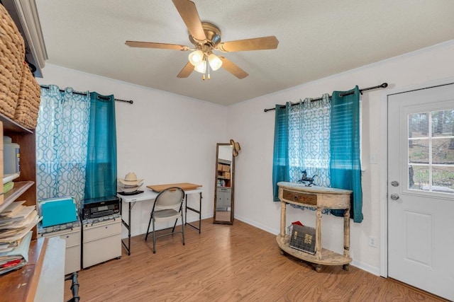 928 Moccasin Trl, La Grange, TX 78945 - office area featuring wood finished floors, a ceiling fan, and a textured ceiling