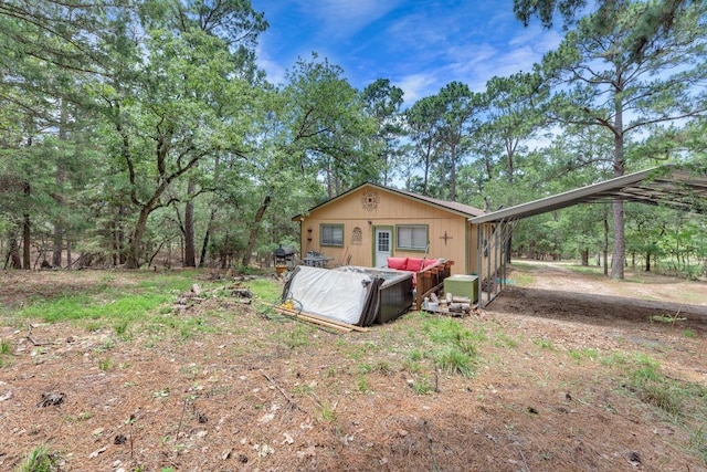 928 Moccasin Trl, La Grange, TX 78945 - view of front of property with outdoor lounge area and an attached carport