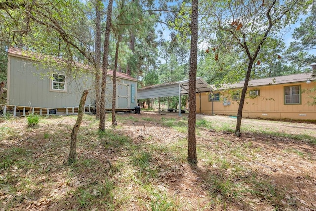 928 Moccasin Trl, La Grange, TX 78945 - view of yard featuring a carport and an outbuilding