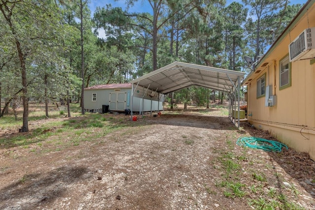 928 Moccasin Trl, La Grange, TX 78945 - view of car parking featuring a detached carport and dirt driveway