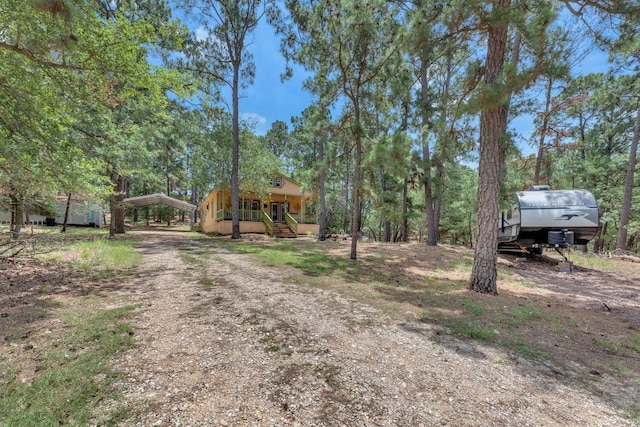 928 Moccasin Trl, La Grange, TX 78945 - view of front facade featuring a detached carport, driveway, and stairs