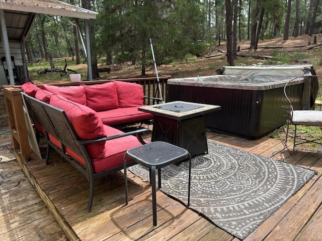 928 Moccasin Trl, La Grange, TX 78945 - deck featuring a hot tub, an outdoor hangout area, and view of scattered trees