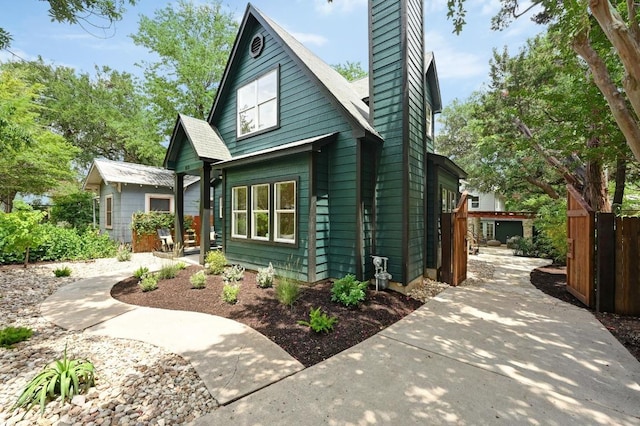 803 Jessie St, Austin, TX 78704 - view of front of home with a chimney and a patio area